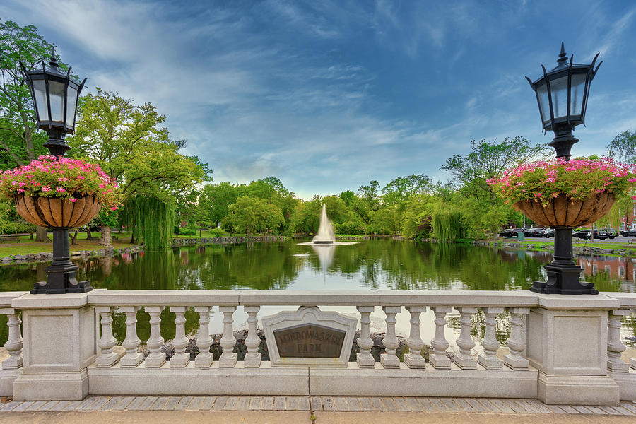 Mindowaskin Park fountain and pond in Westfield NJ surrounded by trees and historic park lamps