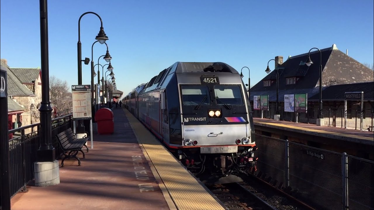 NJ Transit train arriving at the Westfield NJ train station on a clear day